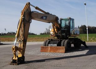 kolové rypadlo CATERPILLAR M322C